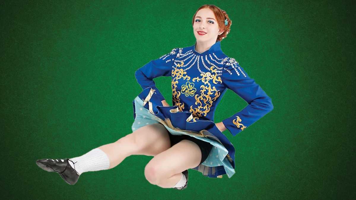 Young lady in Celtic costume demonstrating Irish dancing