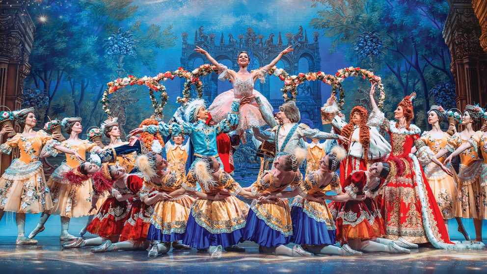 Triumphant Princess Aurora being held high by other dancers
