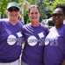 Three ladies wearing Cornhole ATL t-shirts and smiling