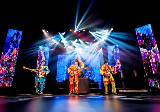 Rain: A Beatles Christmas Tribute on stage 