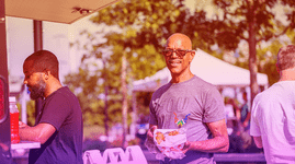 A man enjoys Smalls Big Taste at Sundown Social 