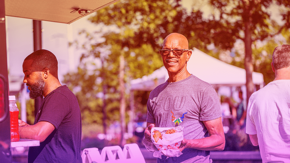 A man enjoys Smalls Big Taste at Sundown Social 
