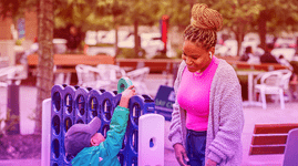 A mom and child play a 
